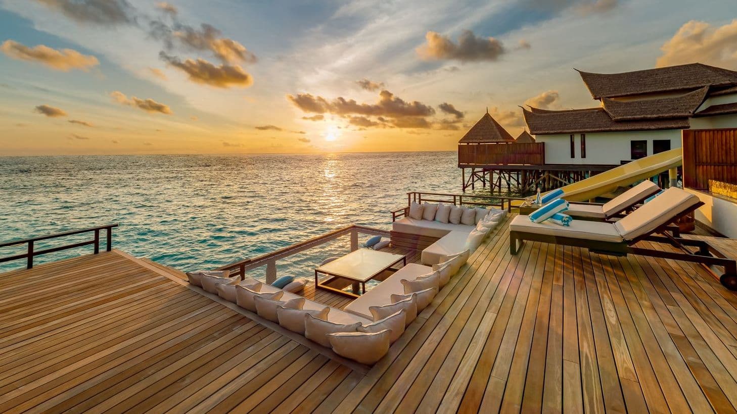 Overwater bungalows on tranquil waters at a Maldives resort on water, offering serene escape.