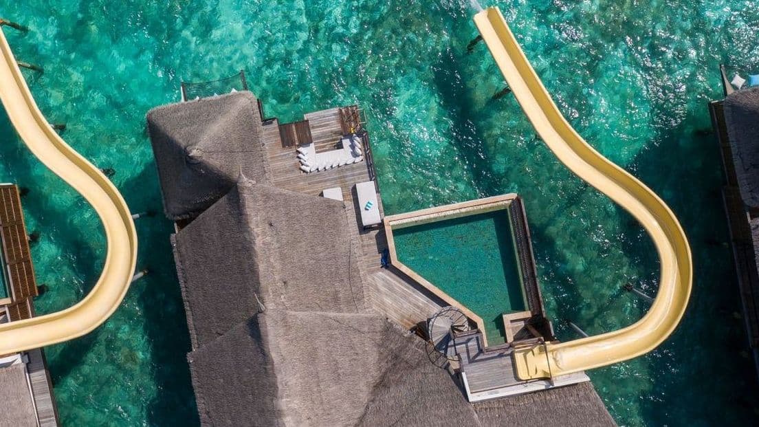 Vibrant water slide at a luxurious resort, perfect for fun.