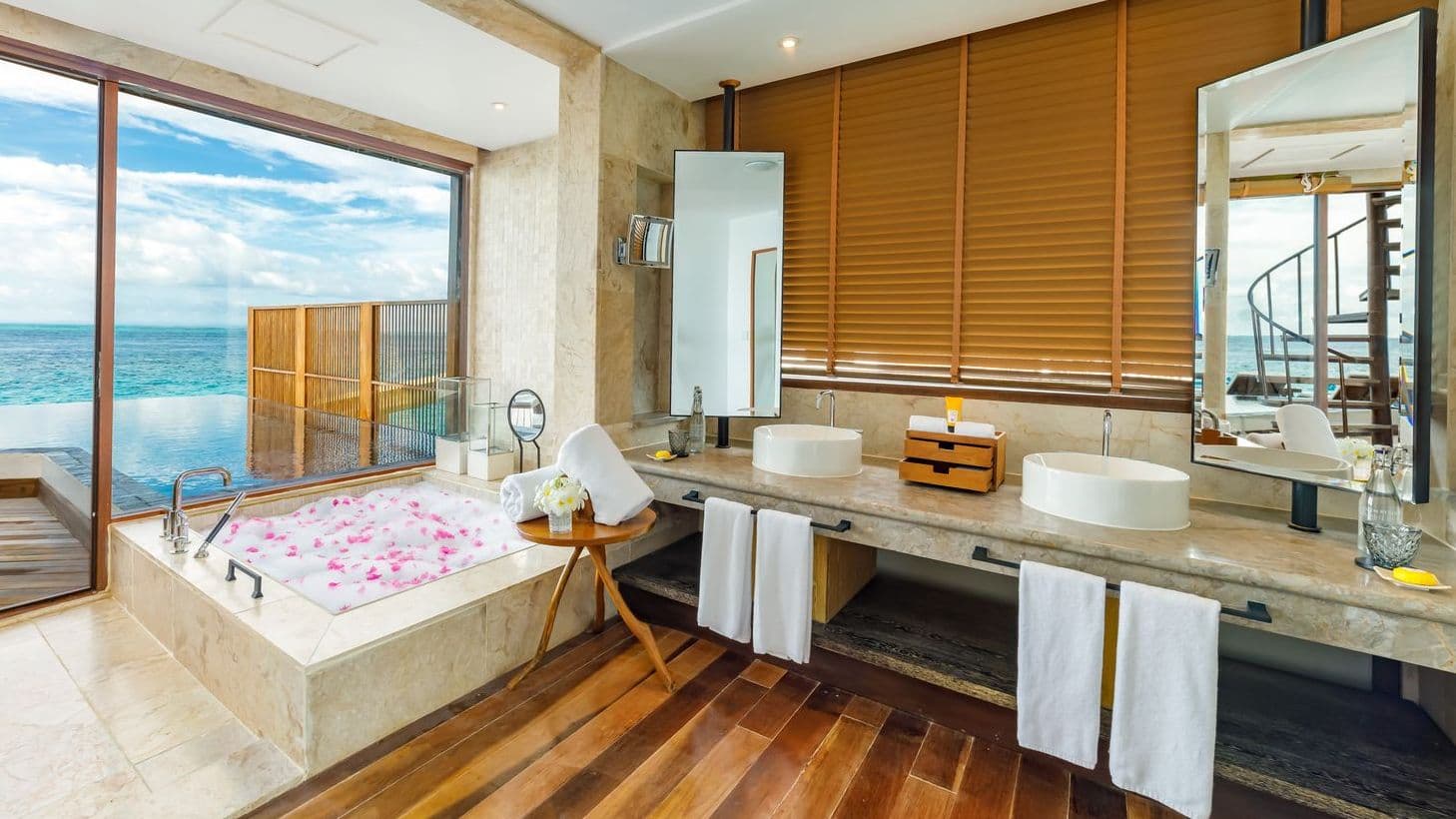 Overwater bungalows on tranquil waters at a Maldives resort on water, offering serene escape.